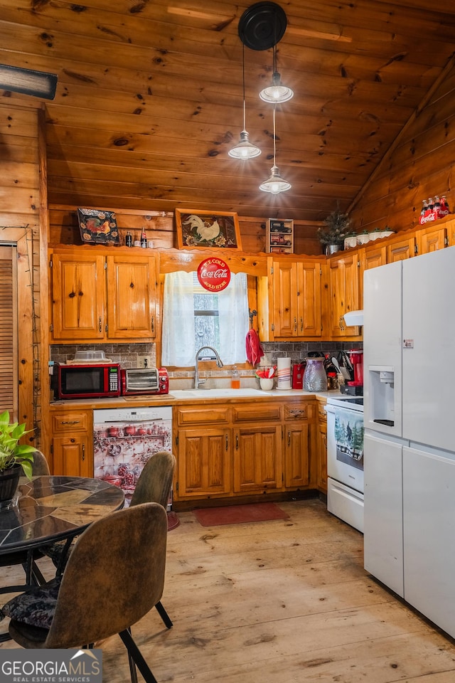 12 Scott Dr, Ellijay, GA 30540 - kitchen with white appliances, light wood finished floors, backsplash, vaulted ceiling, and light countertops