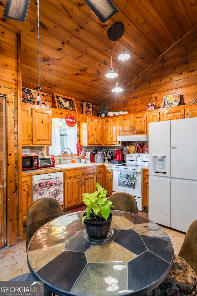 12 Scott Dr, Ellijay, GA 30540 - kitchen with white appliances, vaulted ceiling, under cabinet range hood, wood ceiling, and light countertops