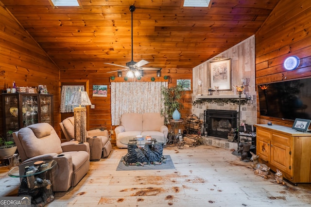 12 Scott Dr, Ellijay, GA 30540 - living room with vaulted ceiling, wood walls, an outdoor stone fireplace, hardwood / wood-style floors, and wooden ceiling