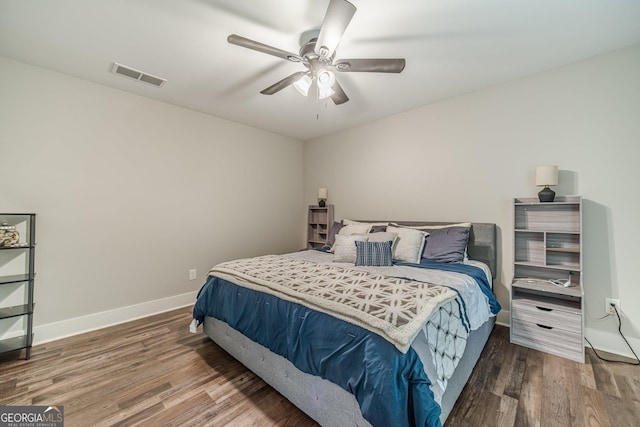 116 6th St, Monroe, GA 30655 - bedroom with wood finished floors and ceiling fan