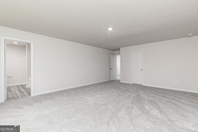 102 Avondale Blvd, Conyers, GA 30013 - carpeted spare room featuring baseboards and recessed lighting