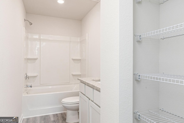 102 Avondale Blvd, Conyers, GA 30013 - bathroom featuring shower / washtub combination, vanity, and wood finished floors
