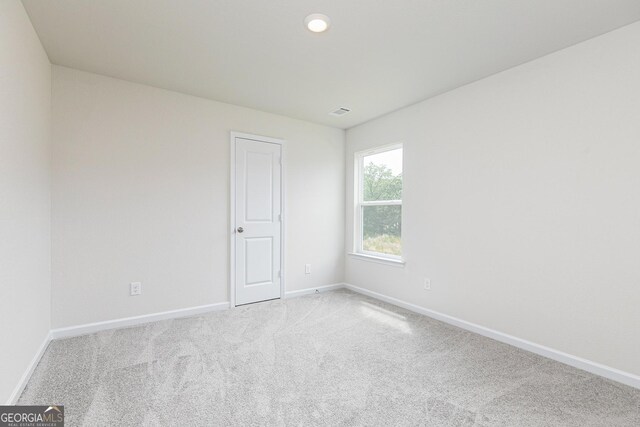 102 Avondale Blvd, Conyers, GA 30013 - carpeted spare room with baseboards and recessed lighting