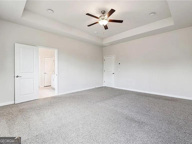 8415 Halford Way, Ball Ground, GA 30107 - spare room with a tray ceiling, ceiling fan, and carpet flooring