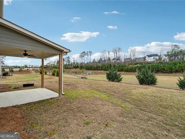 8415 Halford Way, Ball Ground, GA 30107 - view of grassy yard featuring a ceiling fan and a patio area