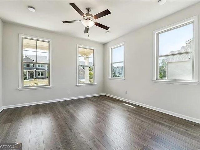 8415 Halford Way, Ball Ground, GA 30107 - spare room featuring plenty of natural light, ceiling fan, and dark wood-style floors