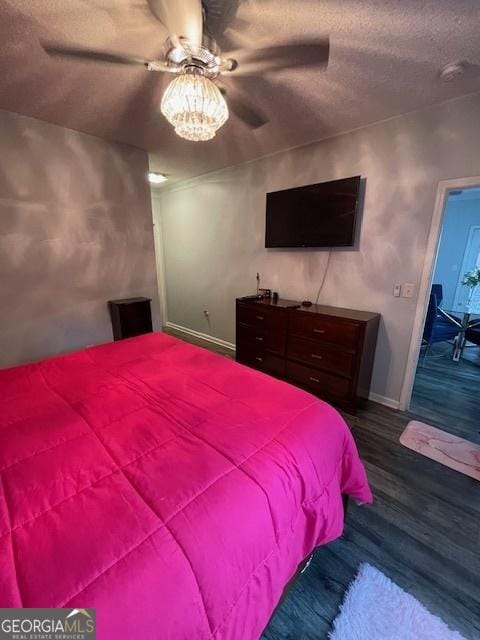 4333 Dunwoody Park Unit 2214, Atlanta, GA 30338 - bedroom featuring dark wood-type flooring, a textured ceiling, and ceiling fan