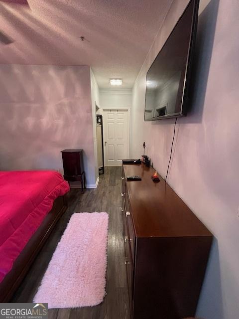 4333 Dunwoody Park Unit 2214, Atlanta, GA 30338 - bedroom with dark wood finished floors and a textured ceiling