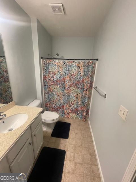 4333 Dunwoody Park Unit 2214, Atlanta, GA 30338 - bathroom featuring vanity, tile patterned floors, and a shower with shower curtain