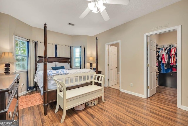21 Hardwood Forest Cir, Brunswick, GA 31525 - bedroom with wood finished floors, a spacious closet, ceiling fan, and a closet