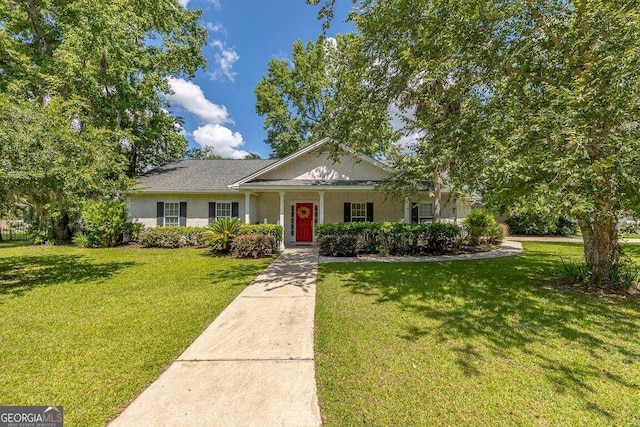 21 Hardwood Forest Cir, Brunswick, GA 31525 - view of front of property featuring a front lawn and stucco siding