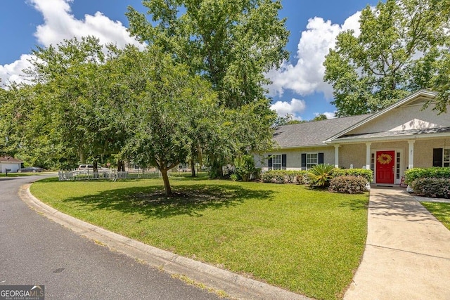21 Hardwood Forest Cir, Brunswick, GA 31525 - view of front of house with a front yard and stucco siding
