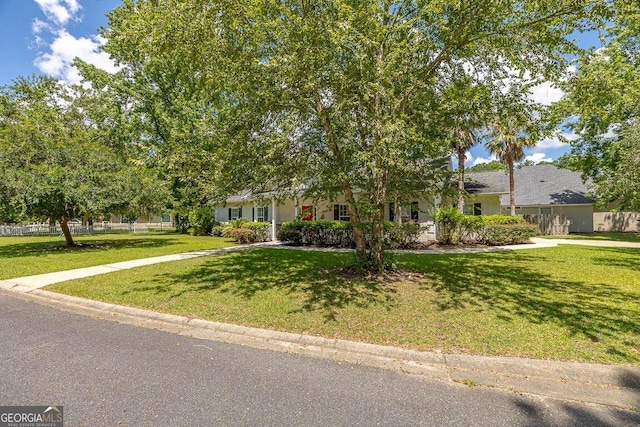 21 Hardwood Forest Cir, Brunswick, GA 31525 - obstructed view of property with a front yard