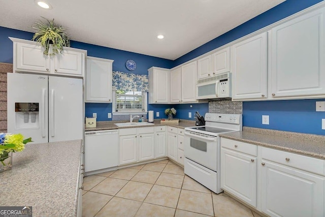 21 Hardwood Forest Cir, Brunswick, GA 31525 - kitchen featuring white appliances, white cabinetry, light countertops, recessed lighting, and light tile patterned floors