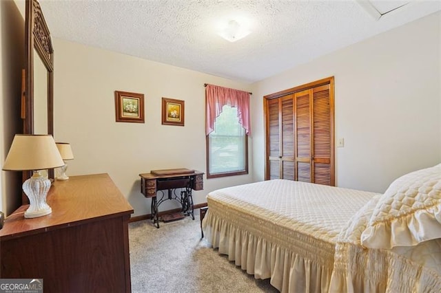 1159 Midland Dr NW, Acworth, GA 30102 - bedroom featuring light colored carpet, a closet, and a textured ceiling