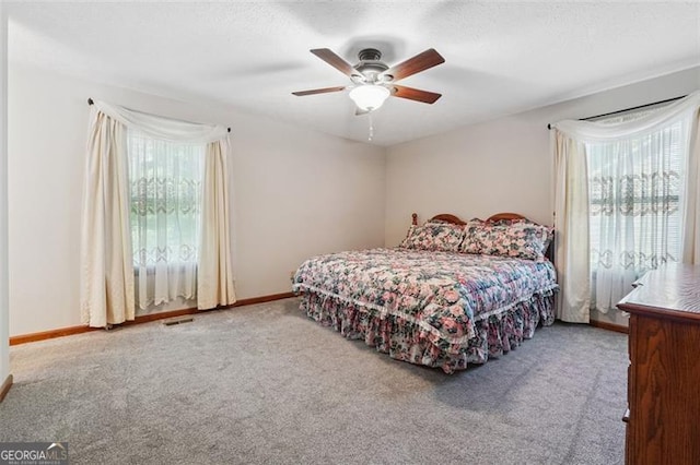 1159 Midland Dr NW, Acworth, GA 30102 - carpeted bedroom with baseboards and ceiling fan