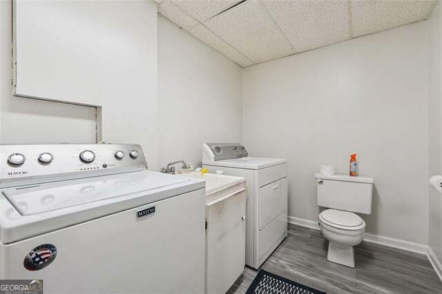 1159 Midland Dr NW, Acworth, GA 30102 - laundry area with washing machine and dryer and dark wood-style flooring