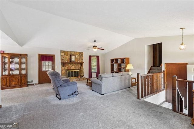 1159 Midland Dr NW, Acworth, GA 30102 - carpeted living room featuring lofted ceiling, ceiling fan, and a fireplace