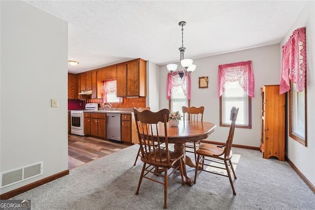 1159 Midland Dr NW, Acworth, GA 30102 - dining area with light carpet and a textured ceiling