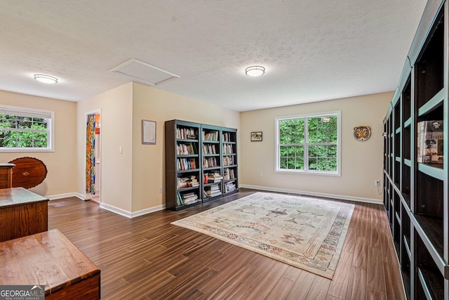 150 Buck Run E, Dahlonega, GA 30533 - sitting room with plenty of natural light, wood finished floors, attic access, and a textured ceiling