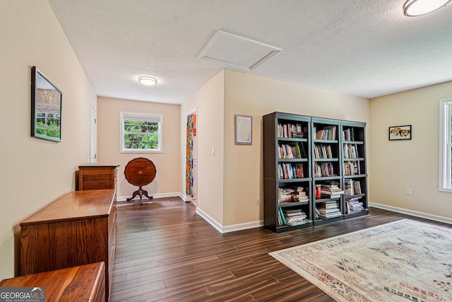 150 Buck Run E, Dahlonega, GA 30533 - hallway with attic access, dark wood-type flooring, and a textured ceiling