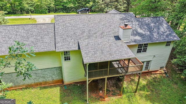 150 Buck Run E, Dahlonega, GA 30533 - back of house with roof with shingles, a sunroom, and a chimney