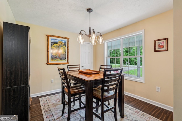 150 Buck Run E, Dahlonega, GA 30533 - dining space featuring a chandelier, dark wood-style flooring, and a textured ceiling