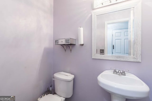539 Riverbirch Trce, Stone Mountain, GA 30087 - half bathroom featuring a sink and toilet