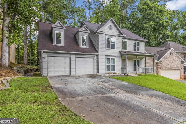 539 Riverbirch Trce, Stone Mountain, GA 30087 - view of front facade featuring a porch, a front yard, concrete driveway, and an attached garage