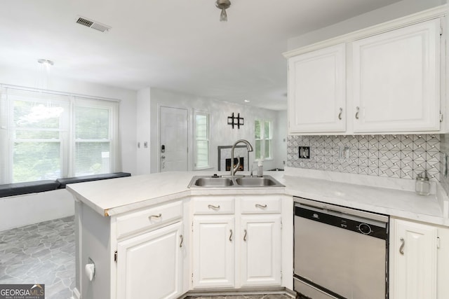 539 Riverbirch Trce, Stone Mountain, GA 30087 - kitchen featuring dishwasher, a peninsula, light countertops, and white cabinetry