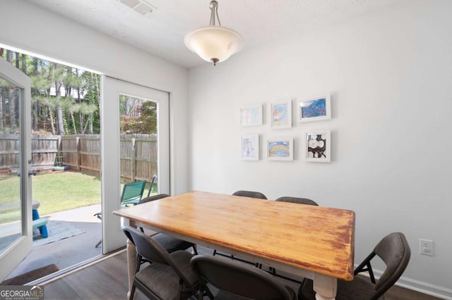 245 Weatherstone Pointe Dr, Woodstock, GA 30188 - dining room with dark wood-type flooring