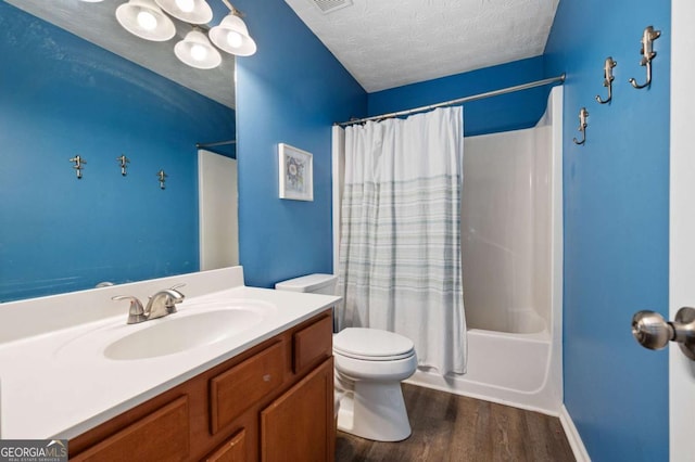 245 Weatherstone Pointe Dr, Woodstock, GA 30188 - bathroom with vanity, wood finished floors, shower / tub combo, and a textured ceiling