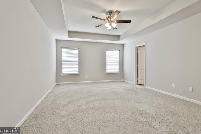 209 Merritt Cir, Newnan, GA 30263 - unfurnished room with a ceiling fan, a raised ceiling, and carpet
