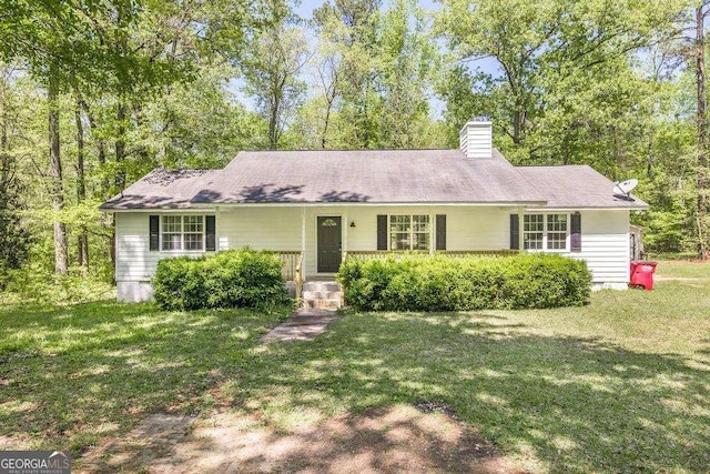 321 Riverbend Ct, Macon, GA 31211 - ranch-style home featuring a front lawn and a chimney
