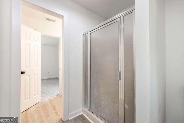321 Riverbend Ct, Macon, GA 31211 - bathroom featuring wood finished floors and a stall shower
