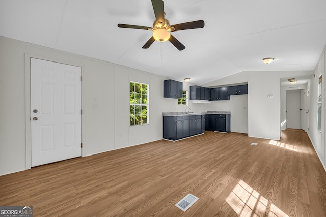 489 Berkeley Rd, Carlton, GA 30627 - unfurnished living room featuring vaulted ceiling, light wood-style flooring, and ceiling fan