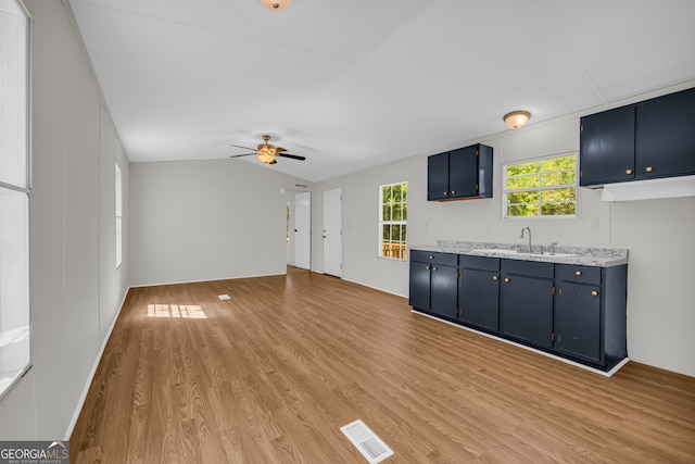 489 Berkeley Rd, Carlton, GA 30627 - unfurnished living room with light wood finished floors, ceiling fan, and vaulted ceiling
