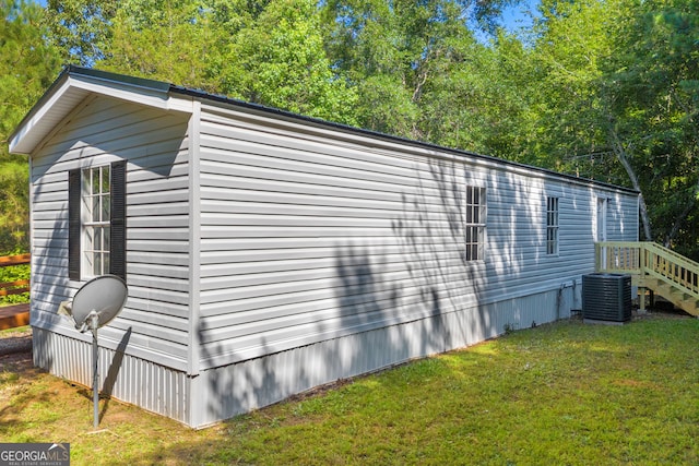 489 Berkeley Rd, Carlton, GA 30627 - view of home's exterior featuring a lawn and a central air condition unit