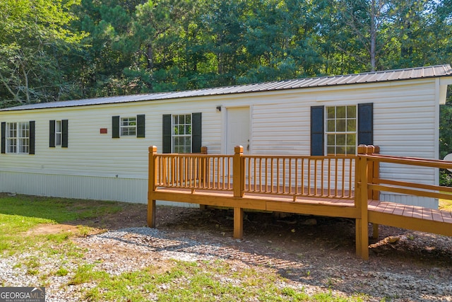 489 Berkeley Rd, Carlton, GA 30627 - back of house with a deck and a metal roof