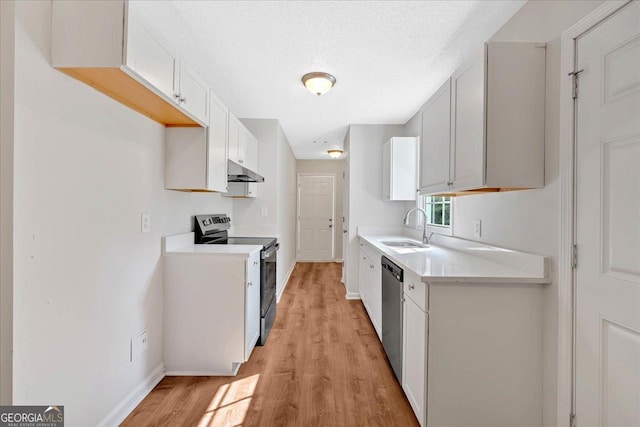 69 Southern Trace Way, Rockmart, GA 30153 - kitchen featuring appliances with stainless steel finishes, under cabinet range hood, light wood-style floors, light countertops, and white cabinetry