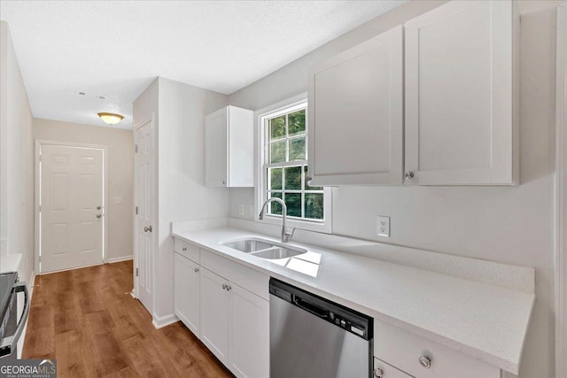 69 Southern Trace Way, Rockmart, GA 30153 - kitchen with stainless steel dishwasher, light wood-style flooring, light countertops, and white cabinets