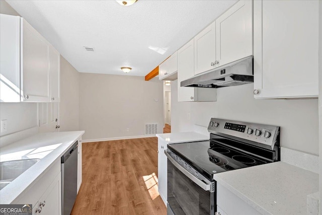 69 Southern Trace Way, Rockmart, GA 30153 - kitchen with stainless steel appliances, under cabinet range hood, light wood-style flooring, and white cabinets