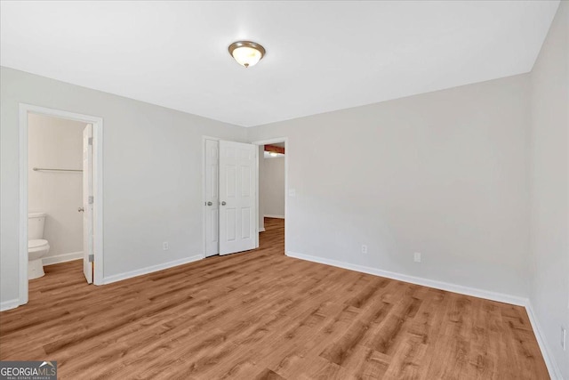 69 Southern Trace Way, Rockmart, GA 30153 - unfurnished bedroom featuring light wood-style floors, connected bathroom, and a closet