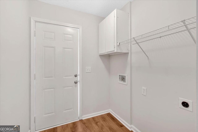 69 Southern Trace Way, Rockmart, GA 30153 - laundry area with cabinet space, electric dryer hookup, hookup for a washing machine, and light wood-style flooring