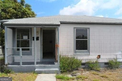 803 36th St, West Palm Beach, FL 33407 - doorway to property with crawl space