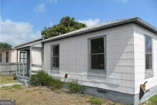 803 36th St, West Palm Beach, FL 33407 - view of side of home featuring crawl space