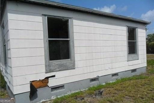 803 36th St, West Palm Beach, FL 33407 - view of property exterior featuring crawl space