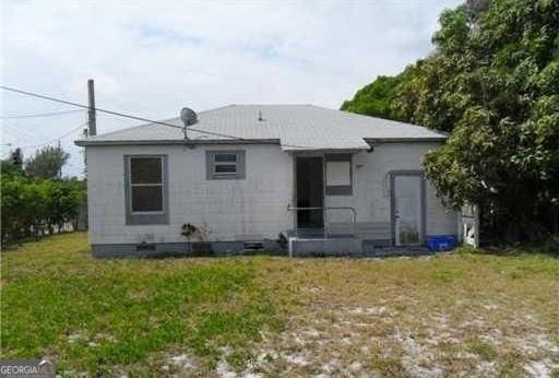 803 36th St, West Palm Beach, FL 33407 - back of house with a yard