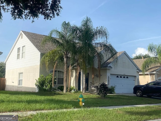 24910 Oakhaven Ct, Lutz, FL 33559 - view of front of house with stucco siding, a garage, a front yard, and concrete driveway