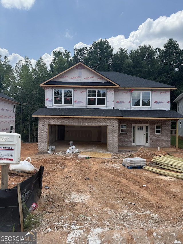 208 Laney Dr, Carrollton, GA 30119 - property in mid-construction with a garage, brick siding, and driveway